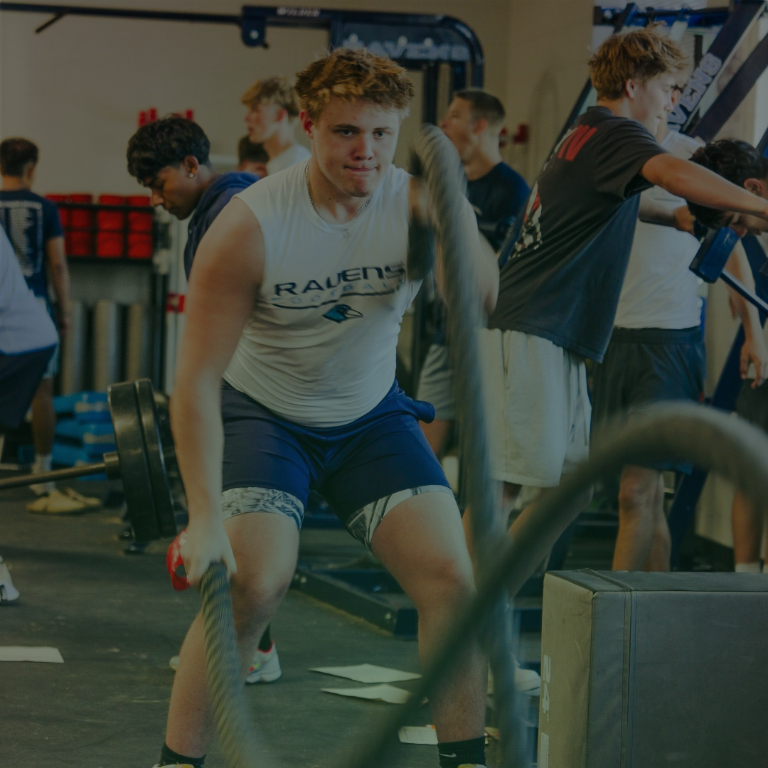 Athlete training with teammates in a performance gym